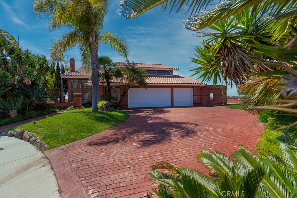 523 Calle Baranda San Clemente, CA 92673 - Photo 4 of 39 a front view of a house with a yard and a garage