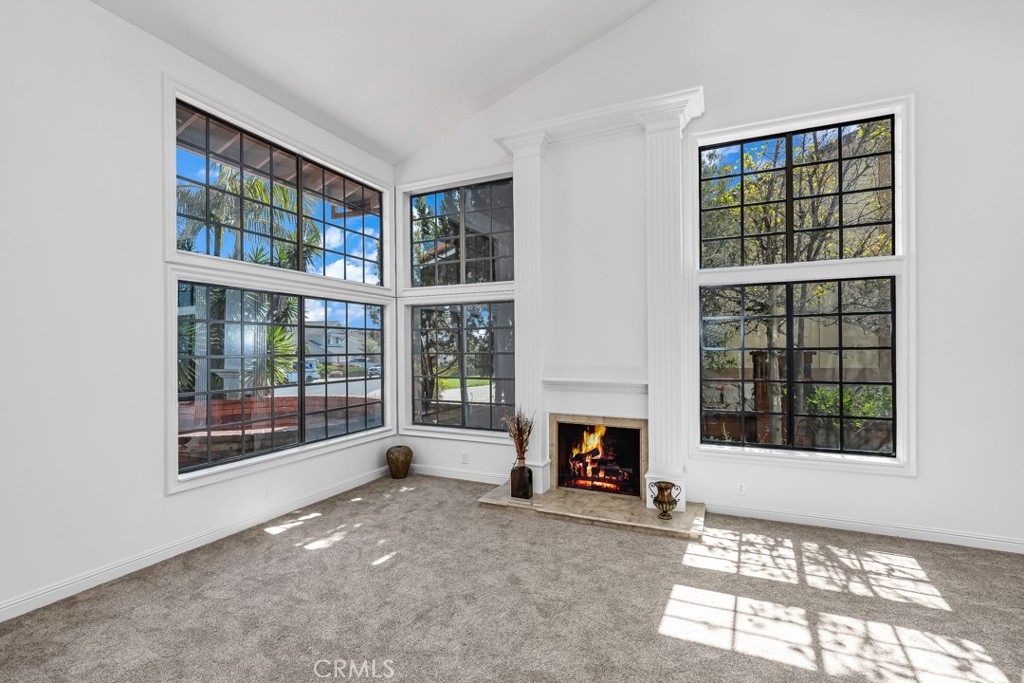 523 Calle Baranda San Clemente, CA 92673 - Photo 7 of 39 a living room with furniture and a fireplace