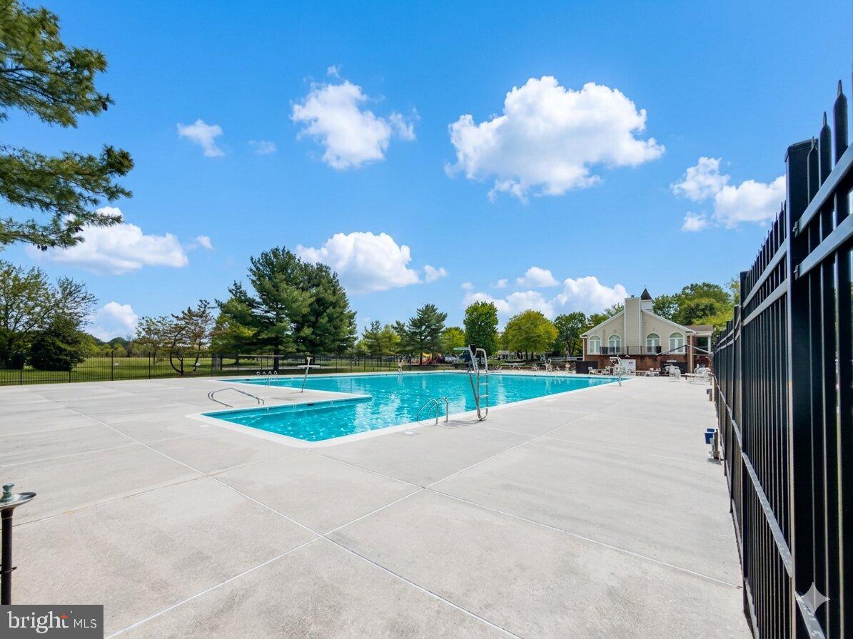 14900 Hydrus Road Silver Spring, MD 20906 - Photo 31 of 33 Sunny oasis with a refreshing pool.