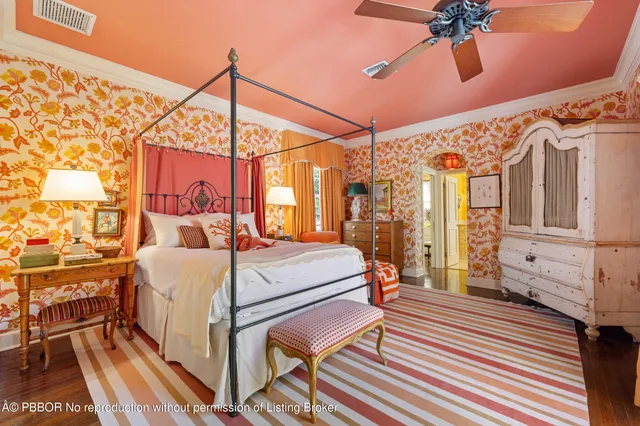 a bed room with a bed and a chandelier