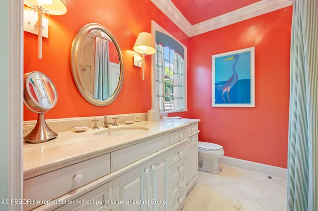a bathroom with a sink a mirror and a toilet