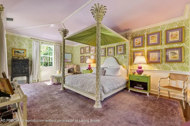 a bedroom with a bed a table and chair