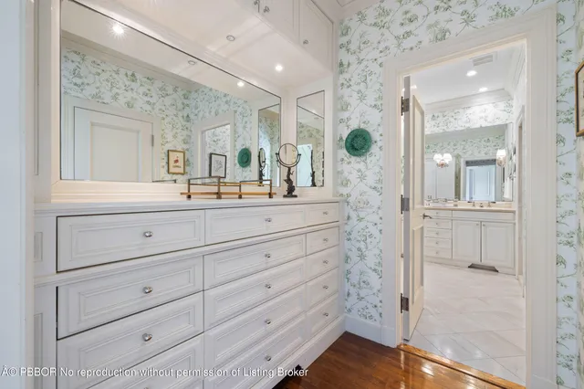 a bathroom with a double vanity sink mirror and shower