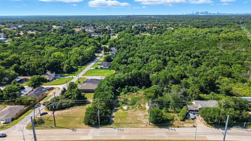 3001 Simpson Stuart Road Dallas, TX 75241 - Photo 7 of 23 Aerial perspective of suburban area featuring a heavily wooded area