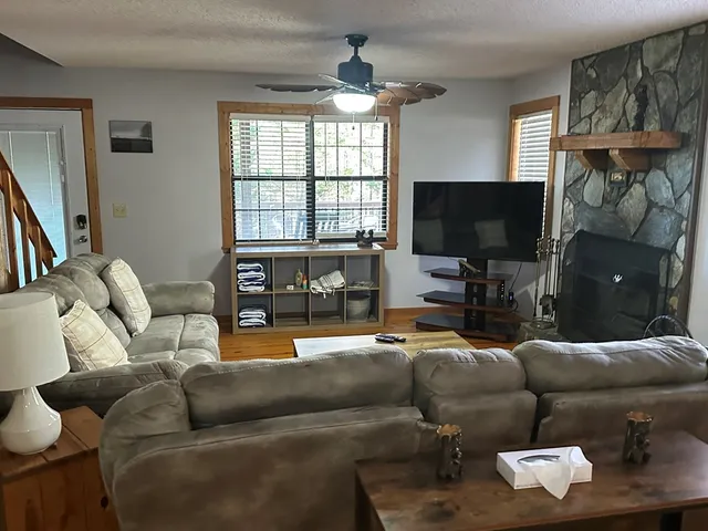 a living room with furniture and a flat screen tv