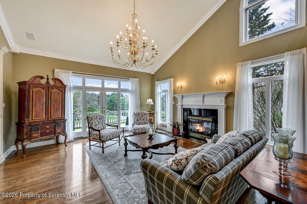 747 Greens Dallas, PA 18612 - Photo 12 of 98 a living room with furniture chandelier and a fireplace