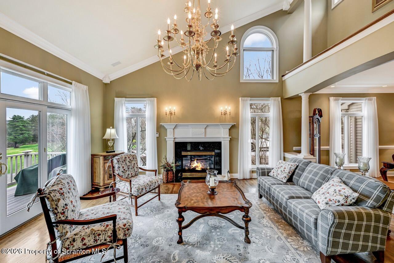 747 Greens Dallas, PA 18612 - Photo 13 of 98 a living room with furniture chandelier and a fireplace