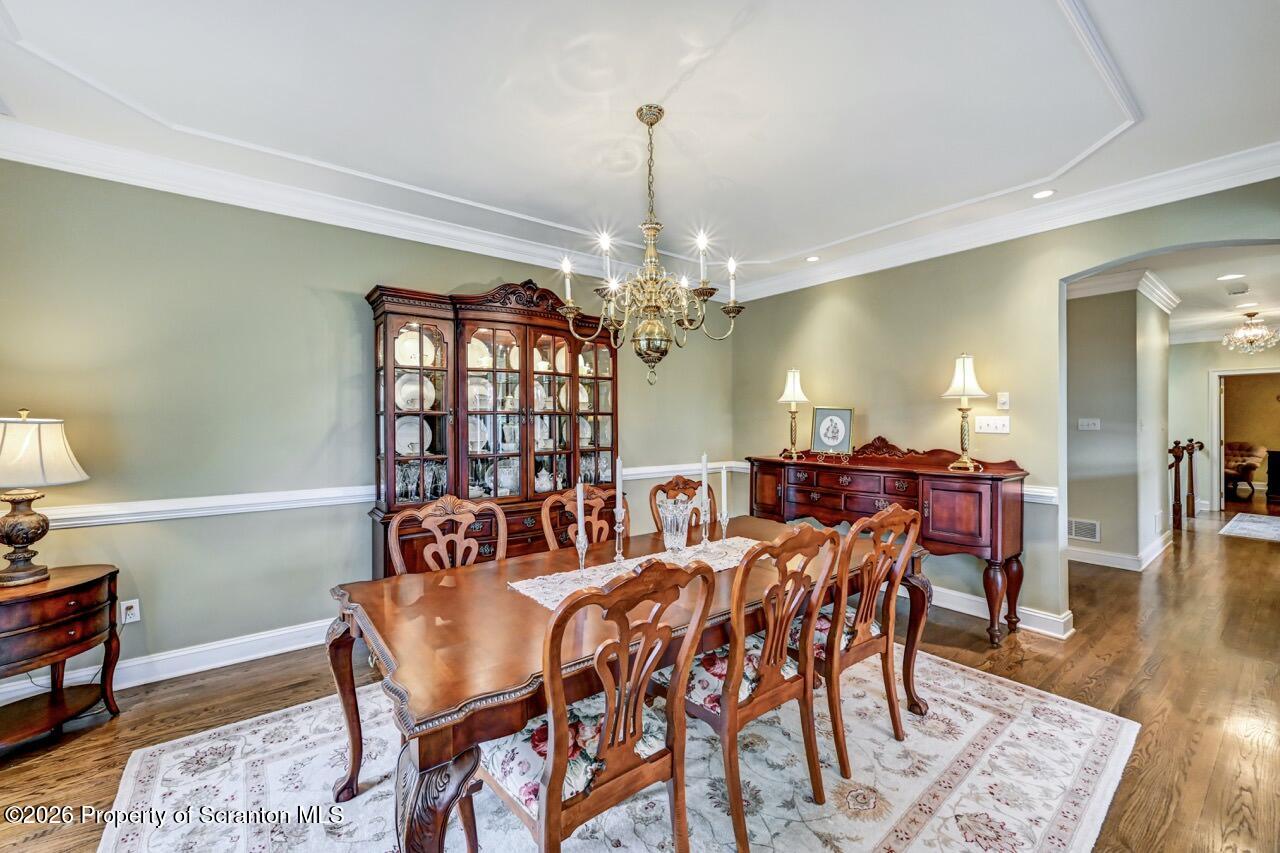 747 Greens Dallas, PA 18612 - Photo 35 of 98 a view of a dining room with furniture wooden floor and chandelier