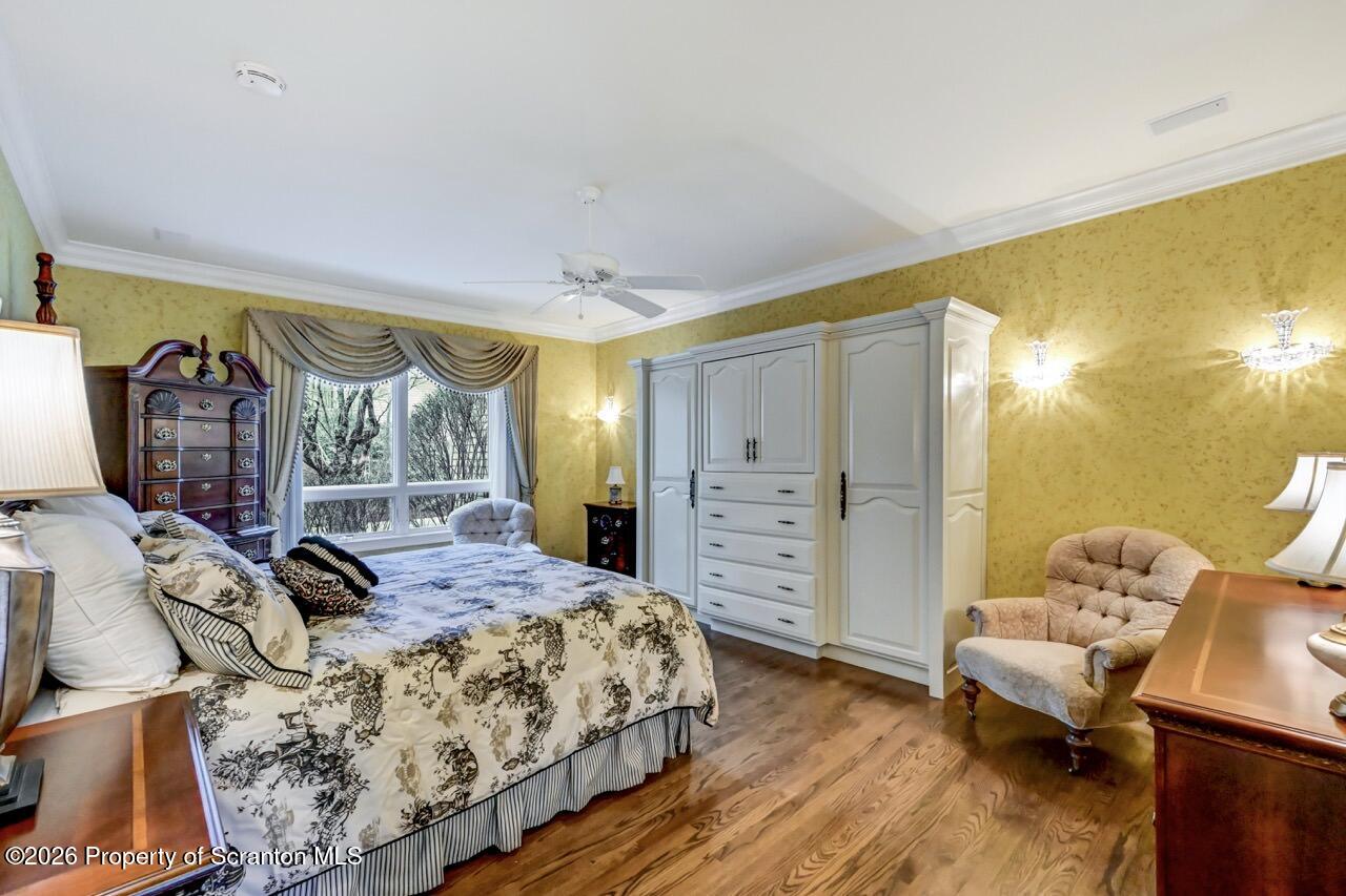 747 Greens Dallas, PA 18612 - Photo 36 of 98 a bedroom with a bed and wooden floor