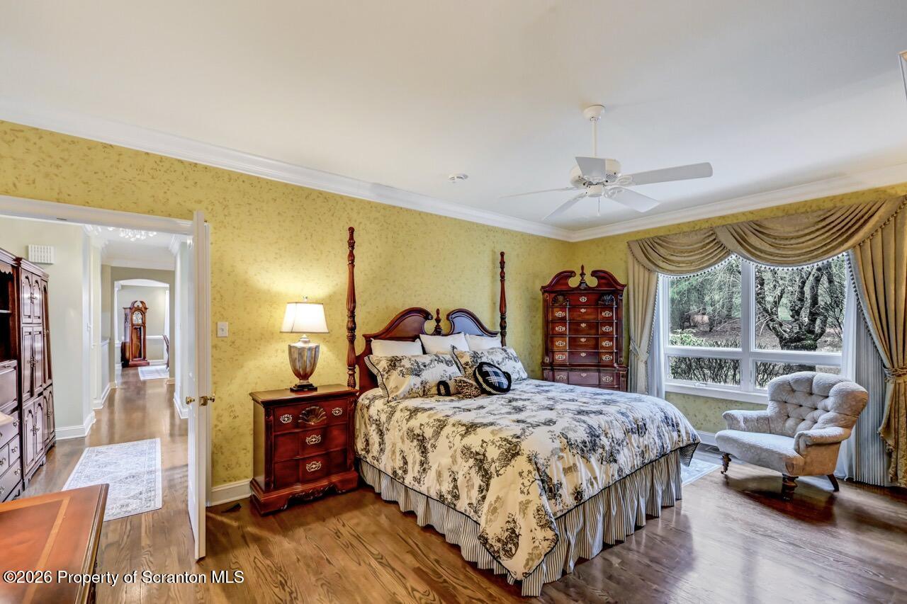 747 Greens Dallas, PA 18612 - Photo 37 of 98 a bedroom with a bed and wooden floor