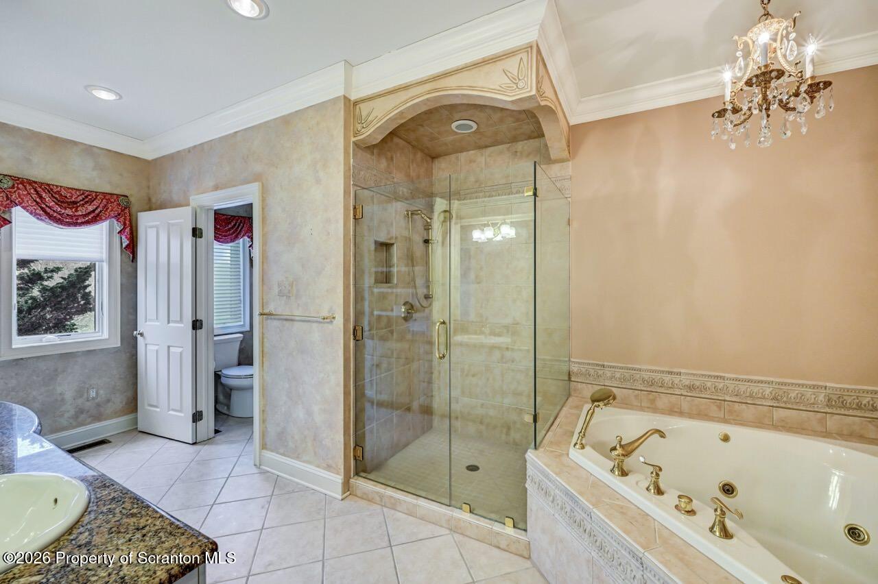 747 Greens Dallas, PA 18612 - Photo 44 of 98 a bathroom with a tub a sink and glass door shower
