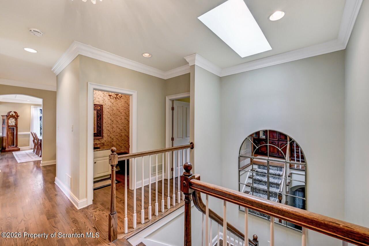 747 Greens Dallas, PA 18612 - Photo 53 of 98 a view of a hallway with wooden floor and stairs