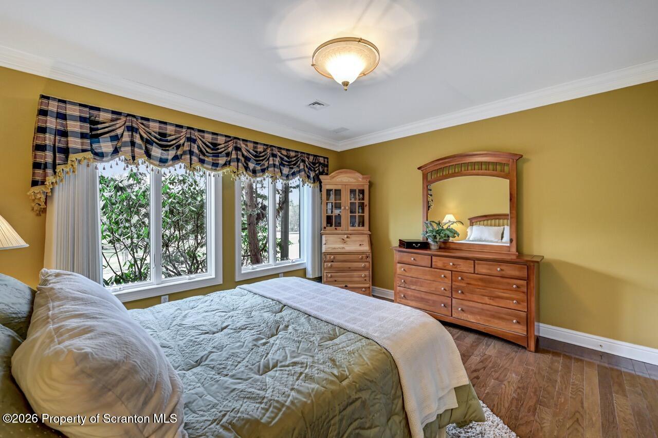 747 Greens Dallas, PA 18612 - Photo 68 of 98 a bedroom with a bed and a dresser next to a window