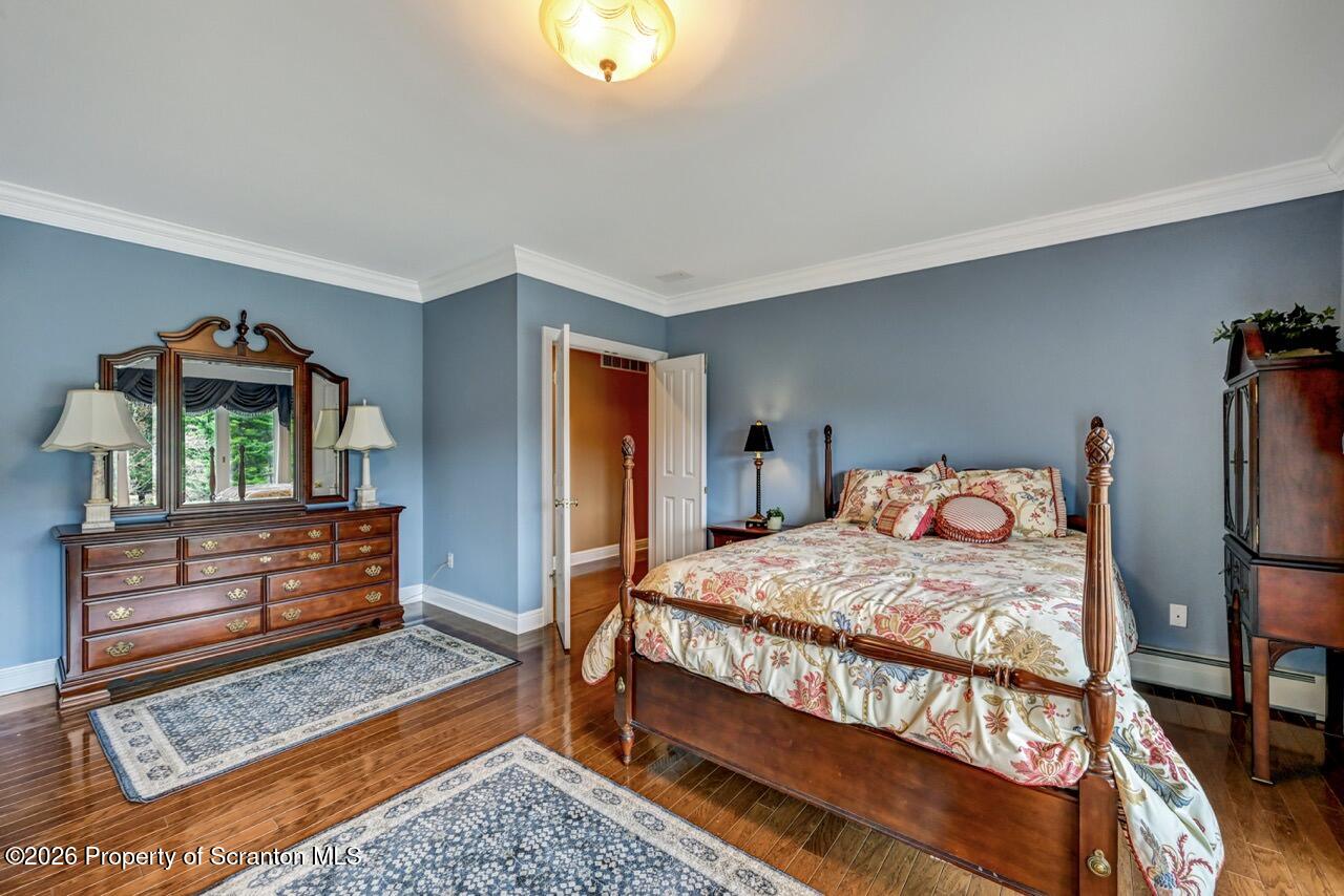 747 Greens Dallas, PA 18612 - Photo 69 of 98 a bedroom with a bed and a dresser in it
