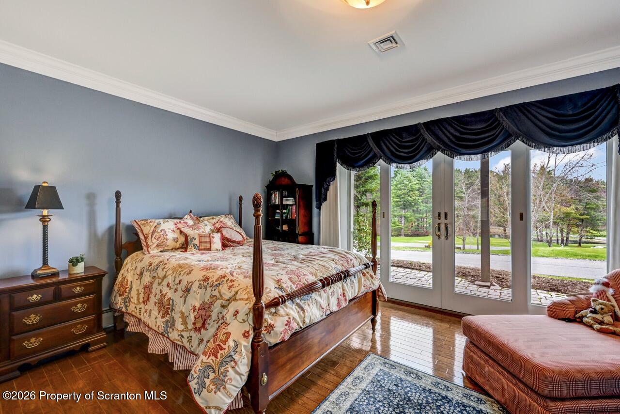 747 Greens Dallas, PA 18612 - Photo 71 of 98 a bedroom with a bed and a dresser next to a window