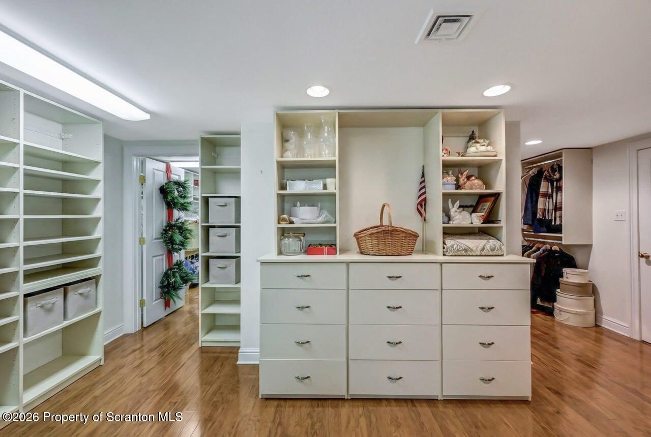 747 Greens Dallas, PA 18612 - Photo 77 of 98 a hallway with cabinets and wooden floor