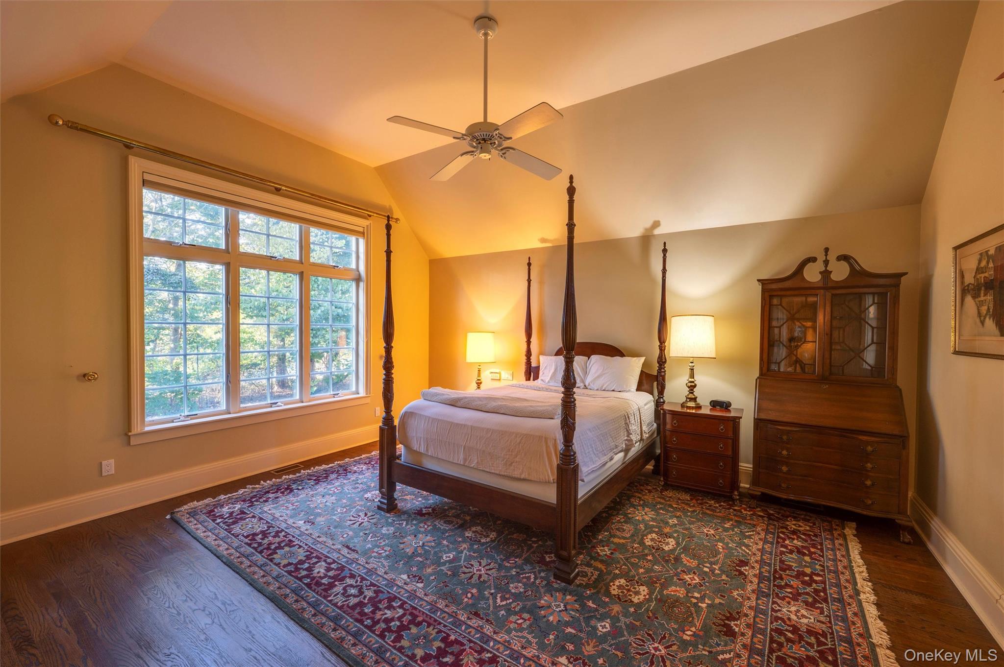 8 Fish Creek Lane Remsenburg, NY 11960 - Photo 13 of 35 Bedroom featuring vaulted ceiling, dark wood-type flooring, and a ceiling fan