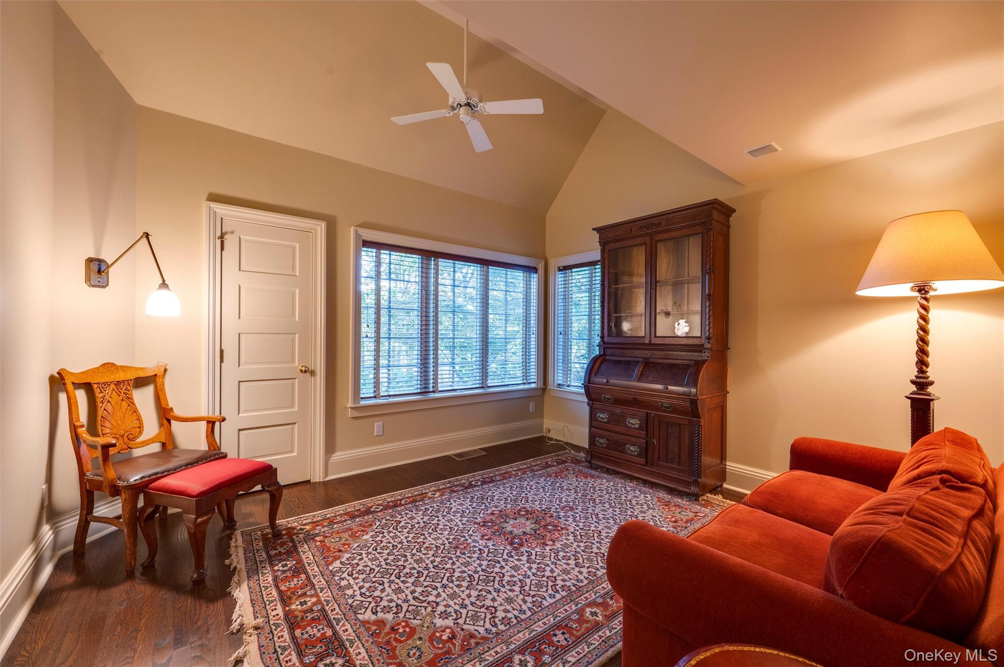 8 Fish Creek Lane Remsenburg, NY 11960 - Photo 20 of 35 Living area featuring dark wood-style floors, ceiling fan, and high vaulted ceiling