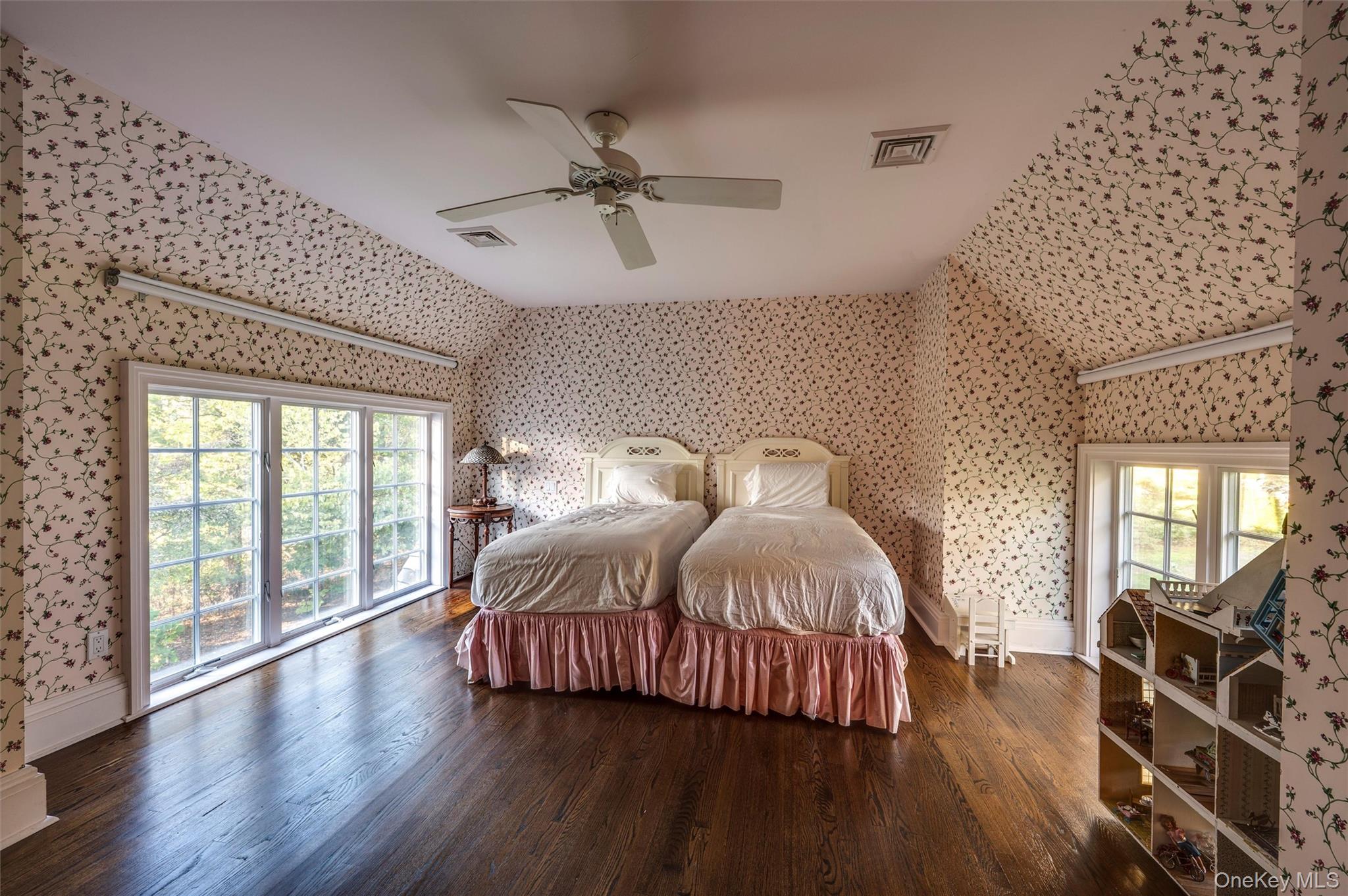 8 Fish Creek Lane Remsenburg, NY 11960 - Photo 23 of 35 Bedroom with wood finished floors, wallpapered walls, and ceiling fan