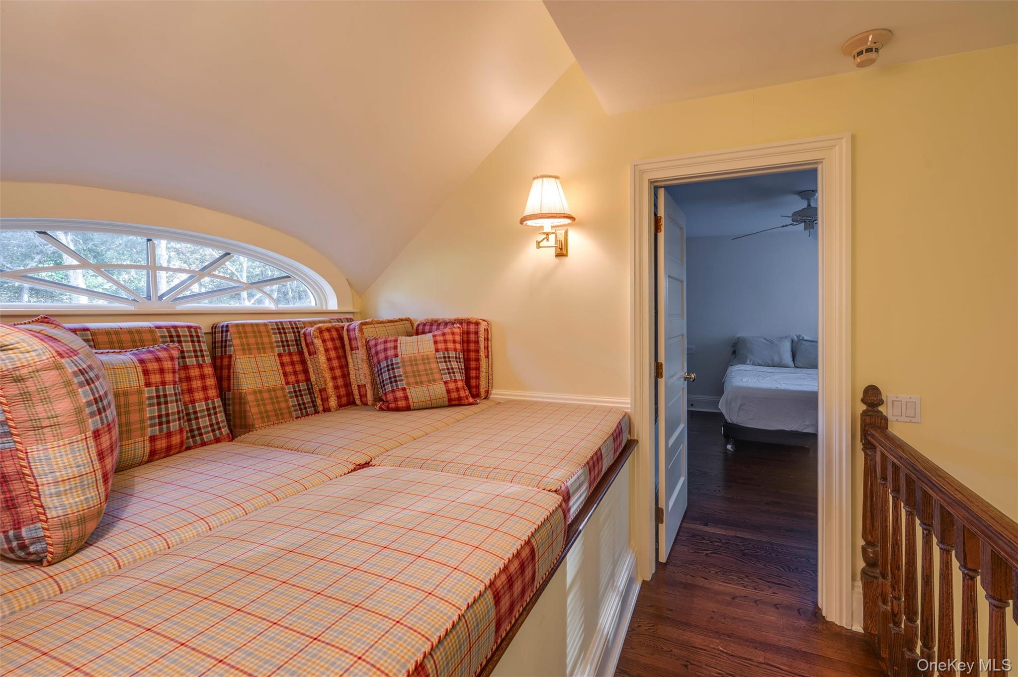 8 Fish Creek Lane Remsenburg, NY 11960 - Photo 24 of 35 Bedroom featuring vaulted ceiling, dark wood finished floors, and a walk in closet