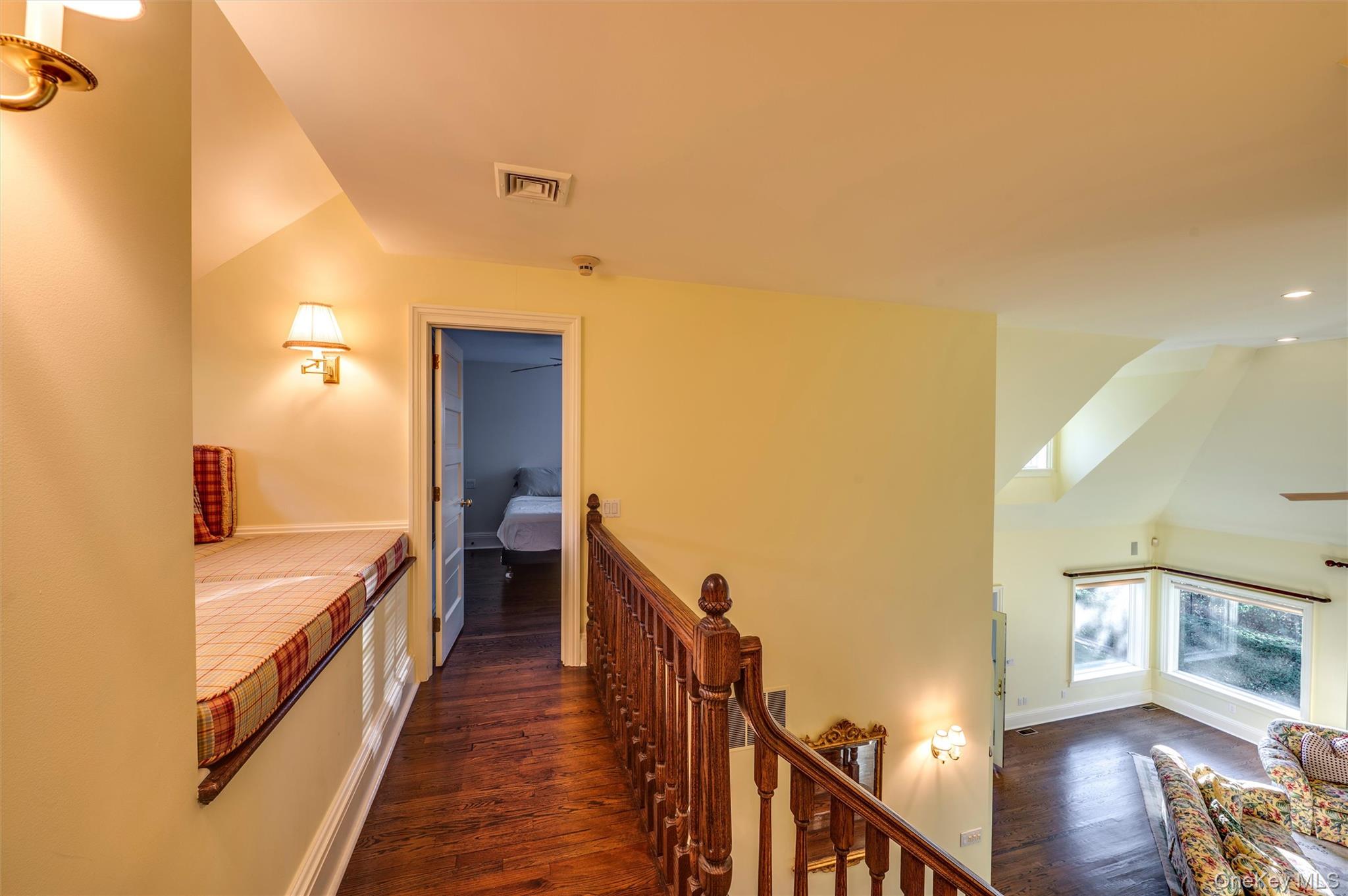 8 Fish Creek Lane Remsenburg, NY 11960 - Photo 25 of 35 Corridor with vaulted ceiling, dark wood-style floors, and an upstairs landing