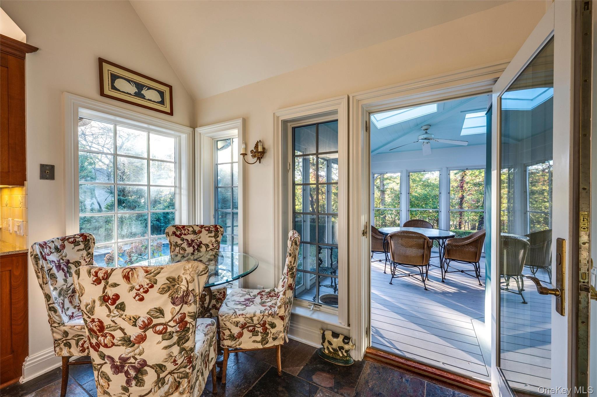 8 Fish Creek Lane Remsenburg, NY 11960 - Photo 26 of 35 Entryway with lofted ceiling, plenty of natural light, and ceiling fan