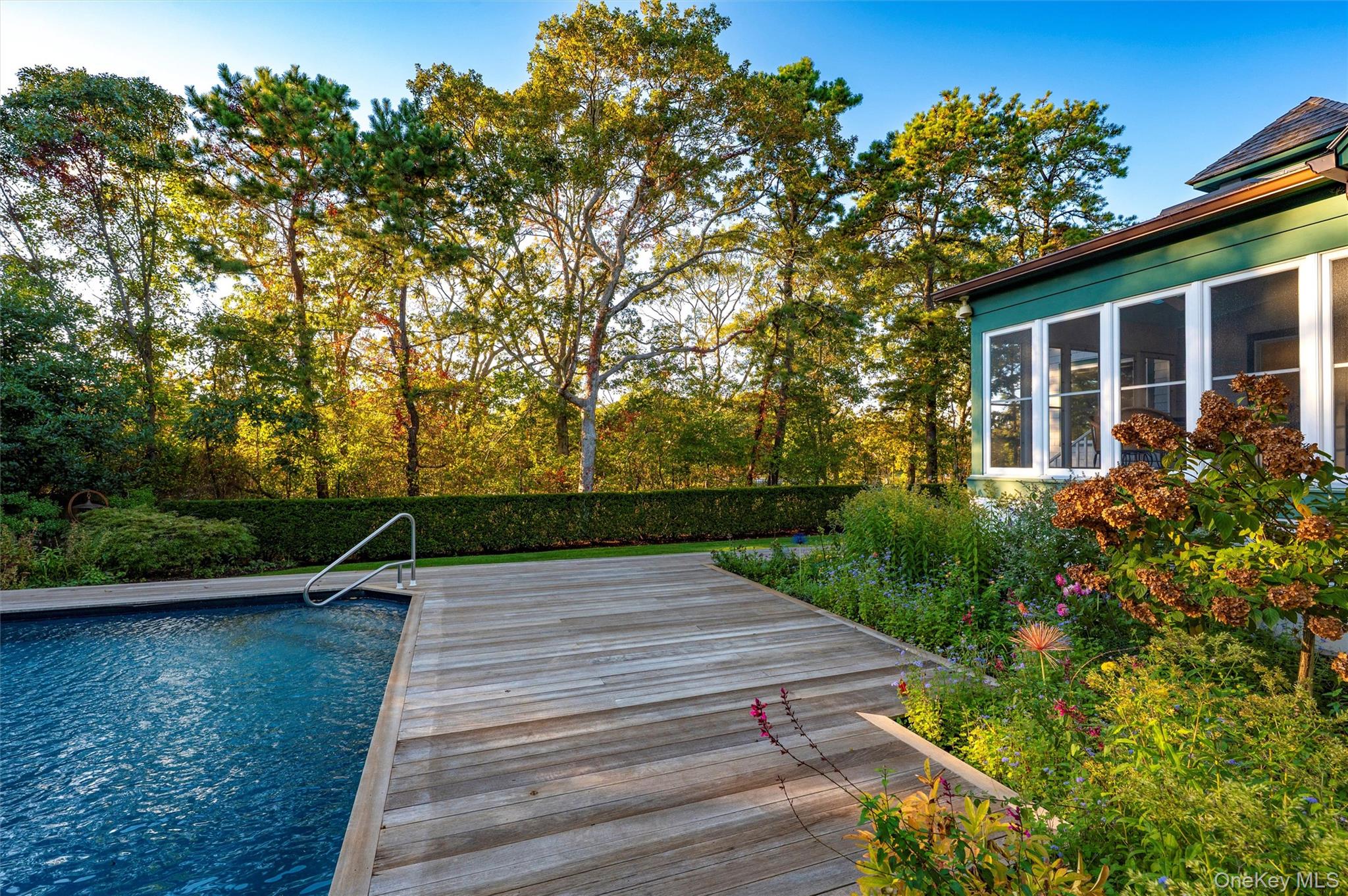 8 Fish Creek Lane Remsenburg, NY 11960 - Photo 27 of 35 Swimming pool featuring a deck