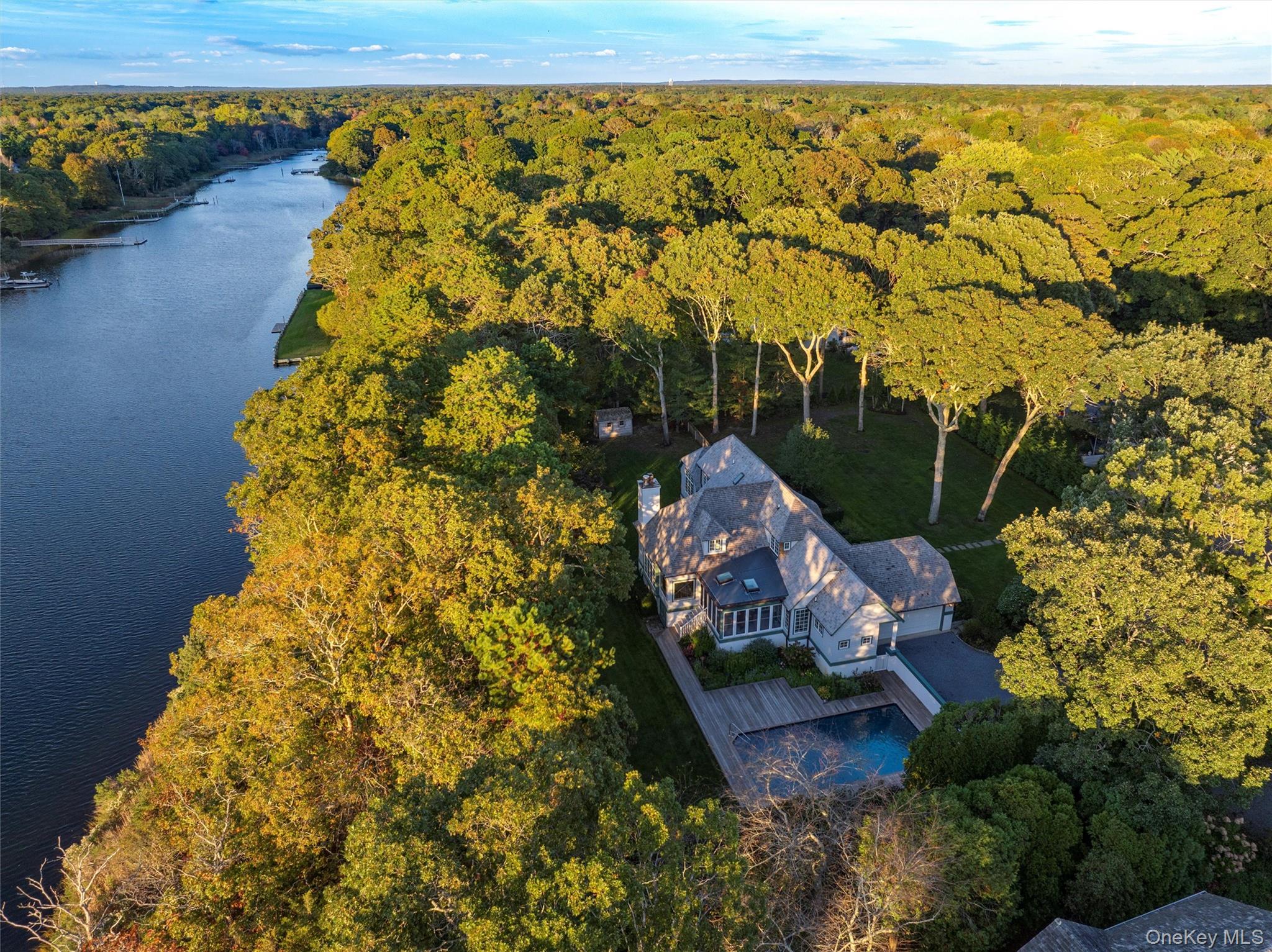 8 Fish Creek Lane Remsenburg, NY 11960 - Photo 6 of 35 Aerial view of a forest and a large body of water