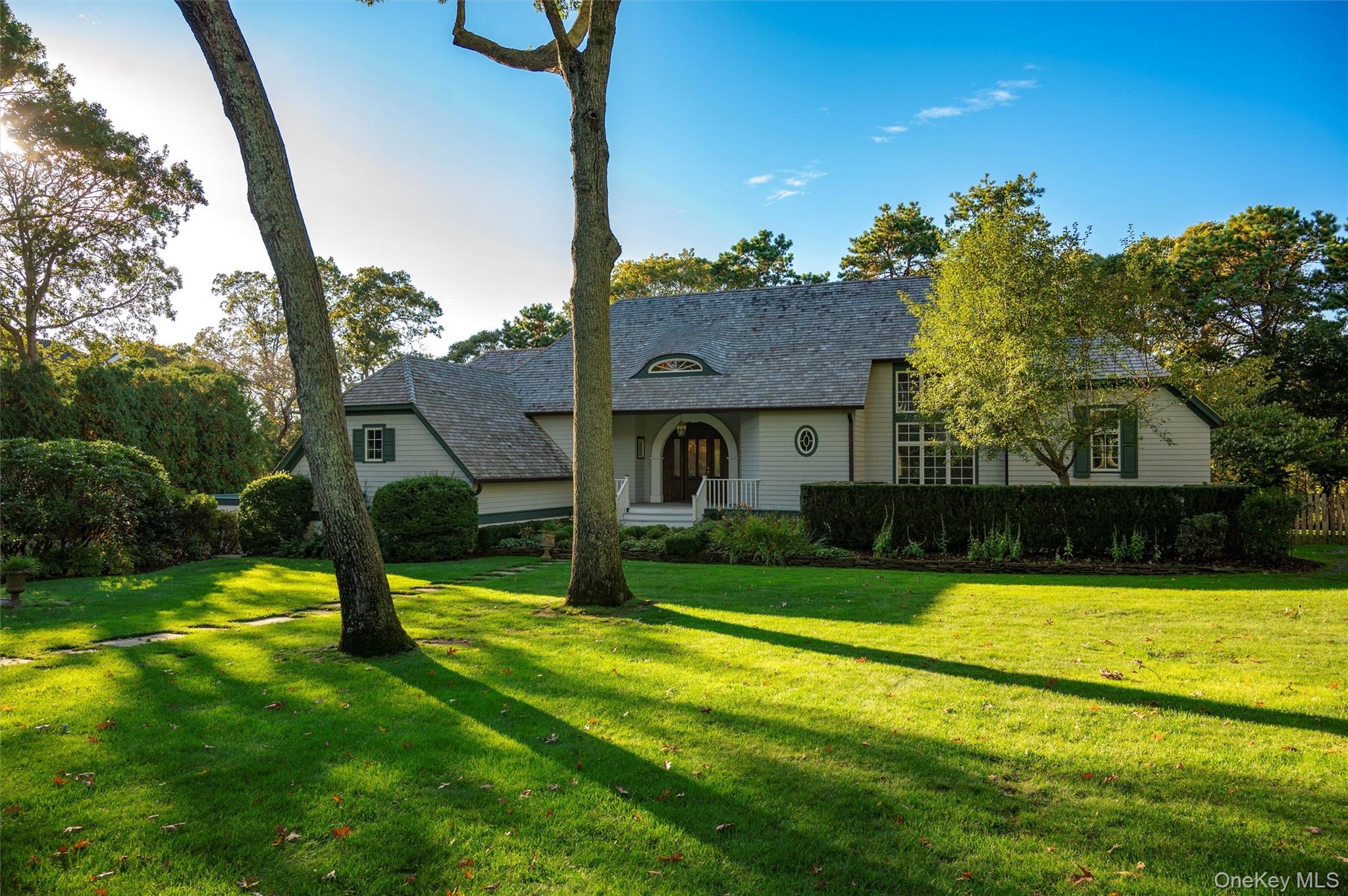 8 Fish Creek Lane Remsenburg, NY 11960 - Photo 8 of 35 View of front of property with a front lawn and covered porch