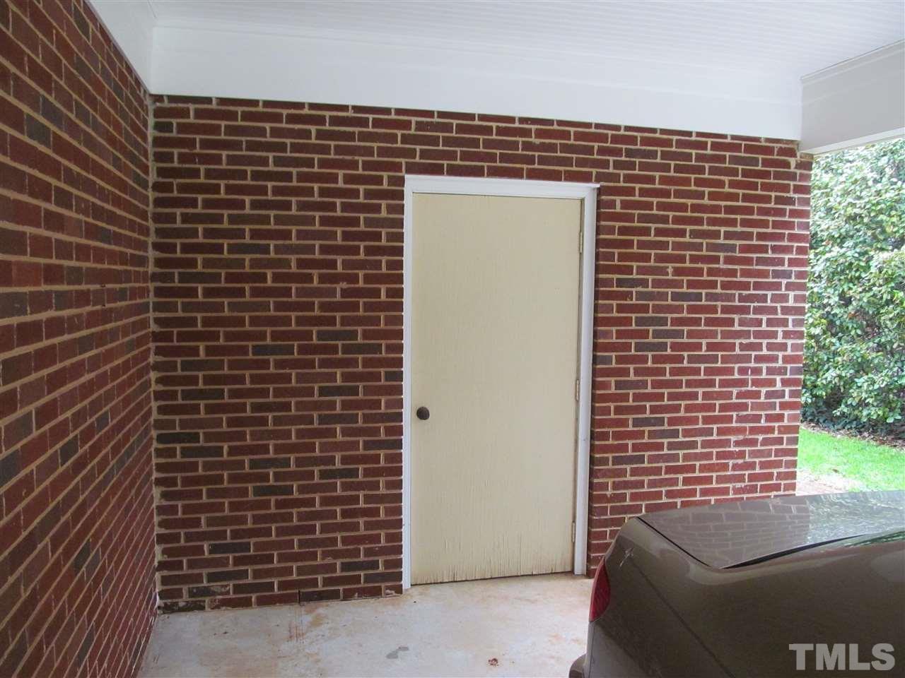 3409 Doyle Road Raleigh, NC 27607 - Photo 24 of 25 Exterior storage room at back of carport.