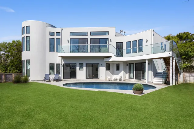 a front view of a building with a yard