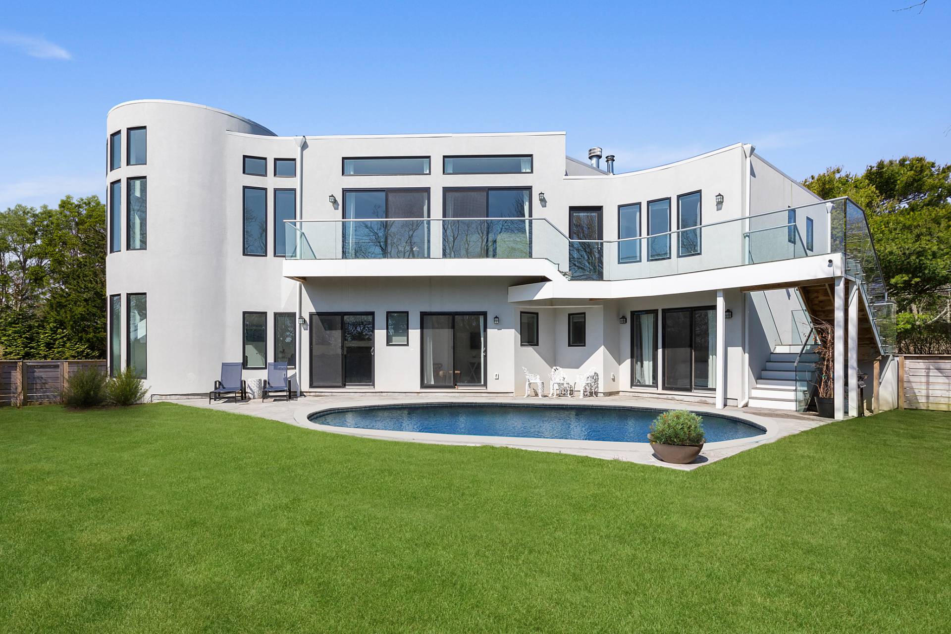 a front view of a building with a yard