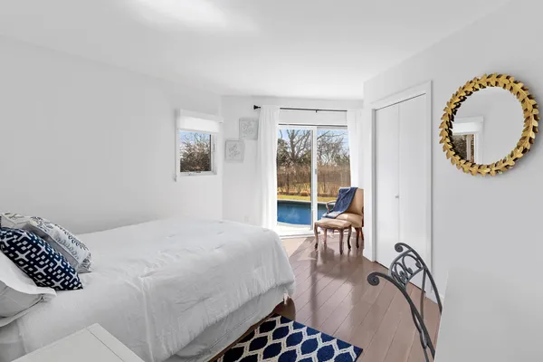 a bedroom with a bed and a chair