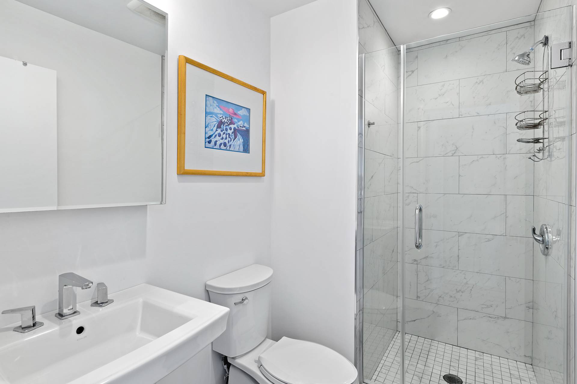 40 Bluff Road Amagansett, NY 11930 - Photo 12 of 16 a white toilet sitting next to a bathroom sink