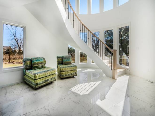 40 Bluff Road Amagansett, NY 11930 - Photo 14 of 16 a living room with furniture and a stairs