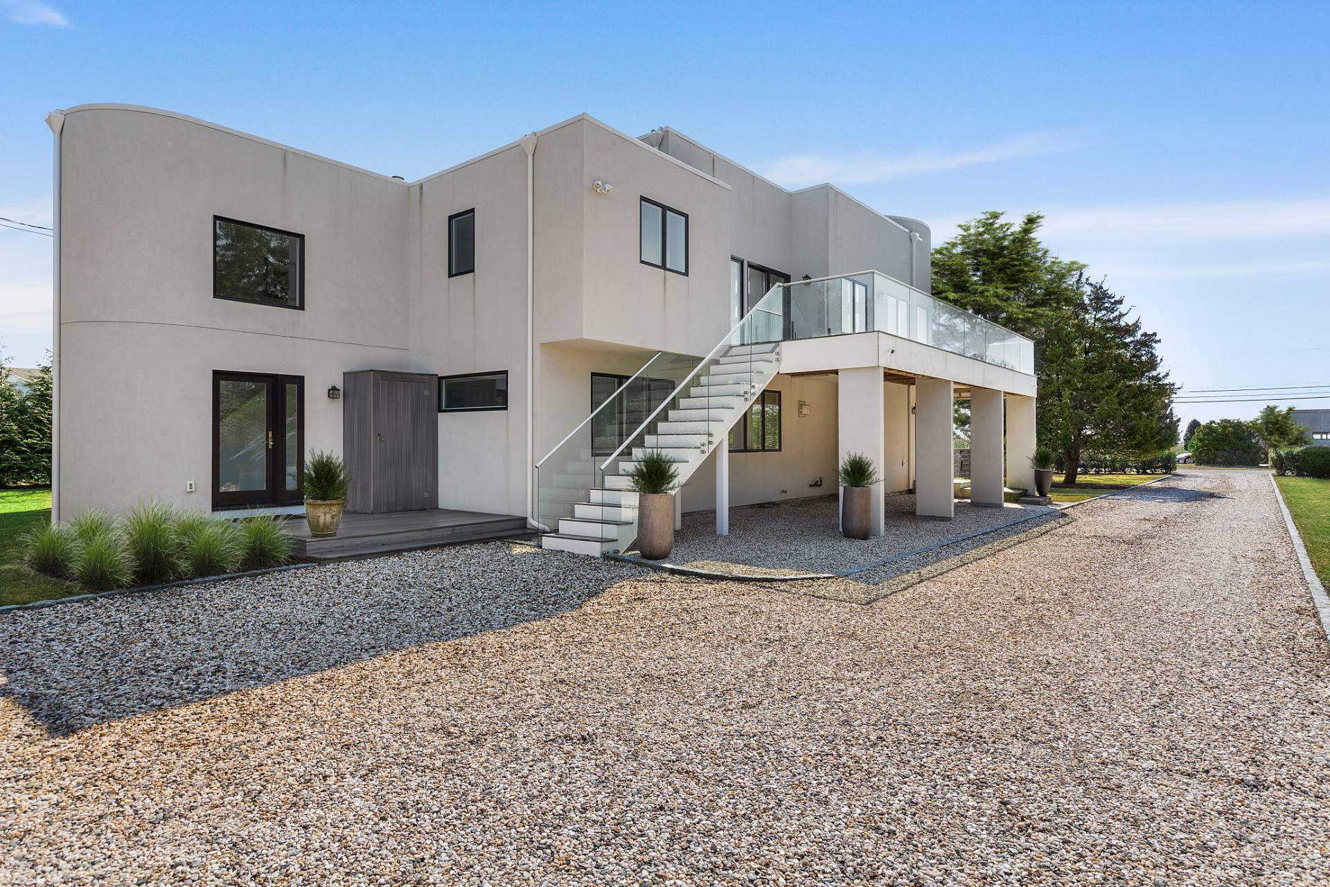 40 Bluff Road Amagansett, NY 11930 - Photo 16 of 16 a view of a house with a yard