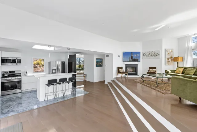 a view of a living room kitchen and dining room