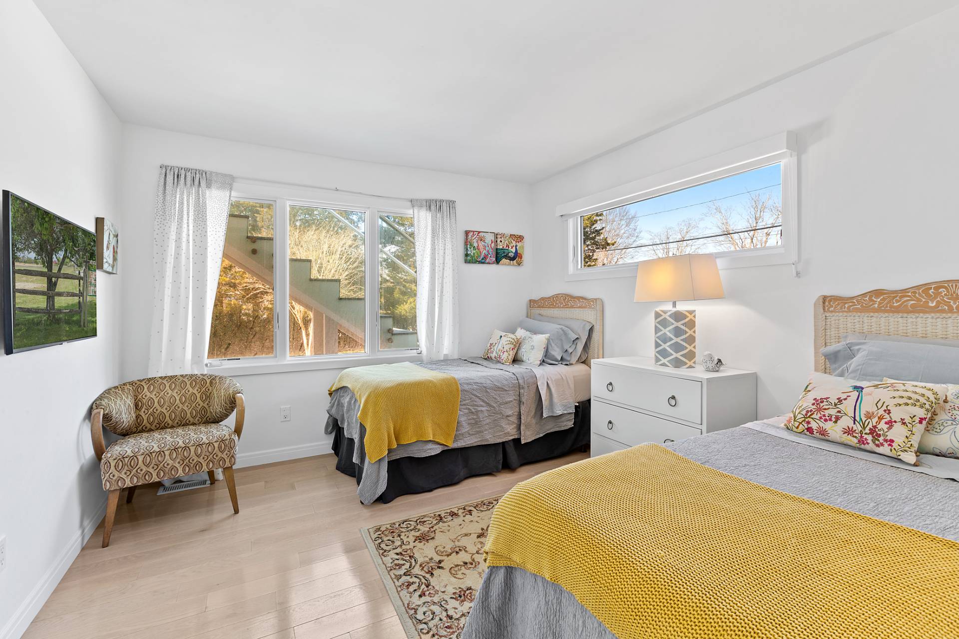 40 Bluff Road Amagansett, NY 11930 - Photo 10 of 16 a bedroom with two beds and a large window
