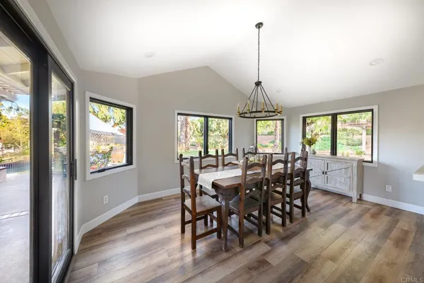a kitchen with stainless steel appliances a stove a sink and a refrigerator