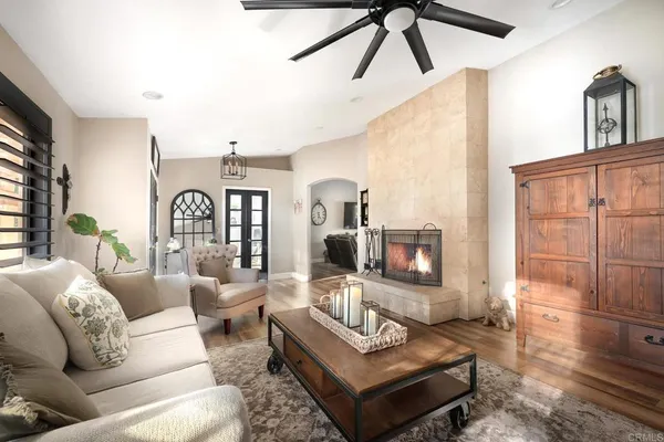 a living room with furniture and a large window