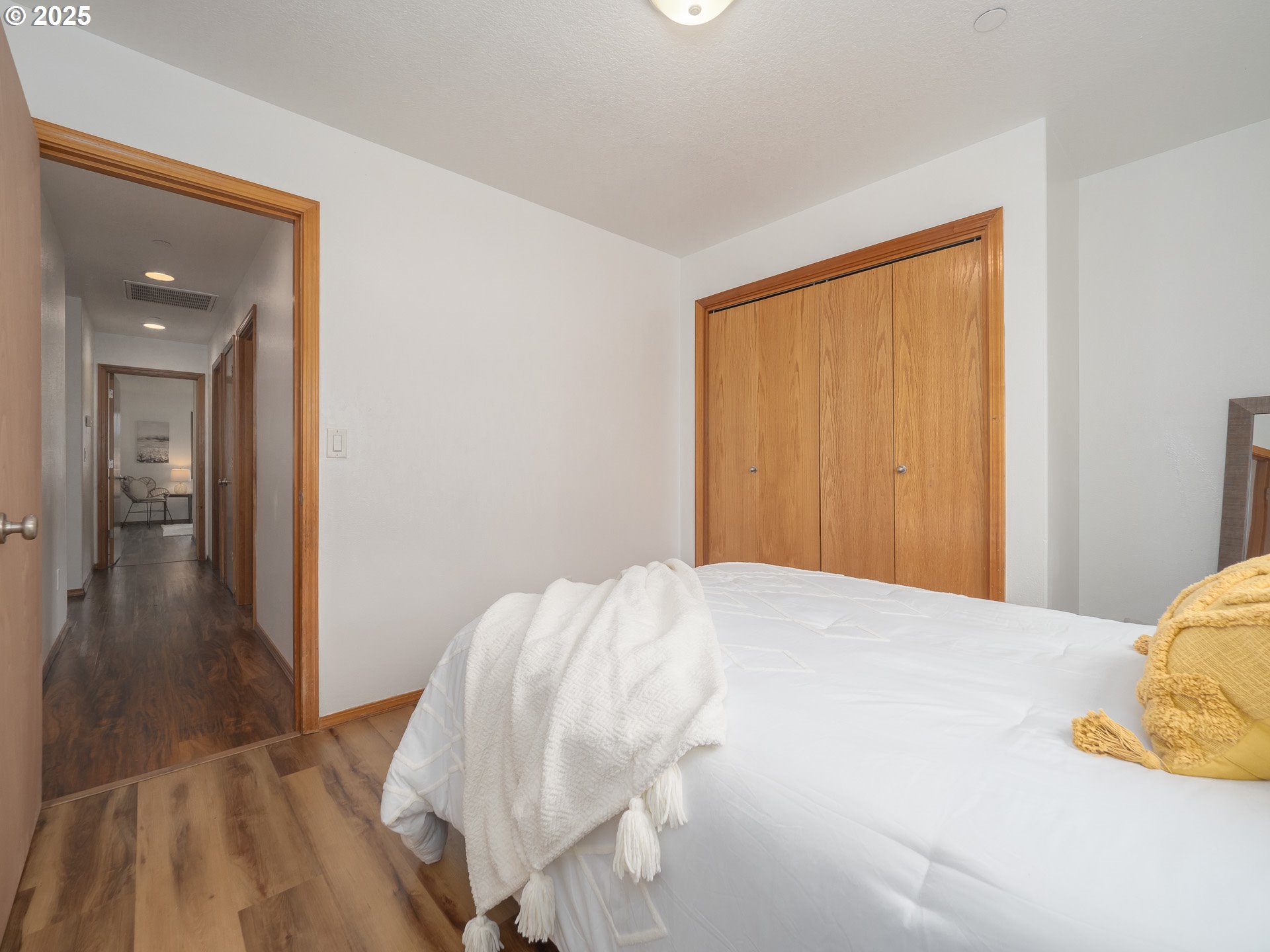 402 East Washington Street Carlton, OR 97111 - Photo 26 of 36 a bedroom with a bed and lamp