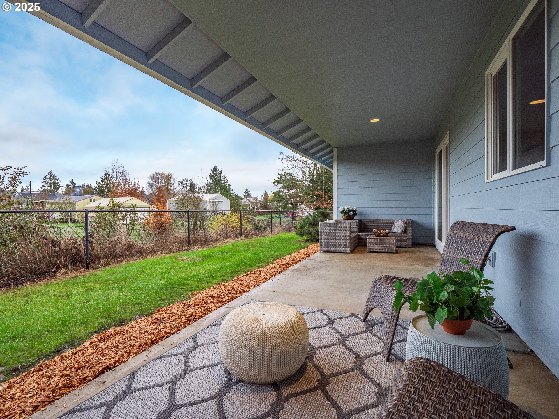 402 East Washington Street Carlton, OR 97111 - Photo 30 of 36 a view of a backyard with seating area and furniture