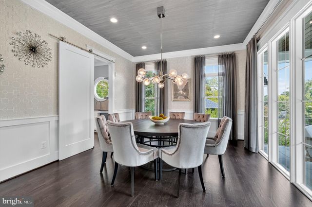 a kitchen with stainless steel appliances and view living room