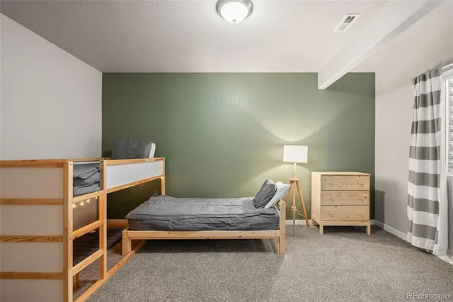 a bedroom with a bed and cabinets