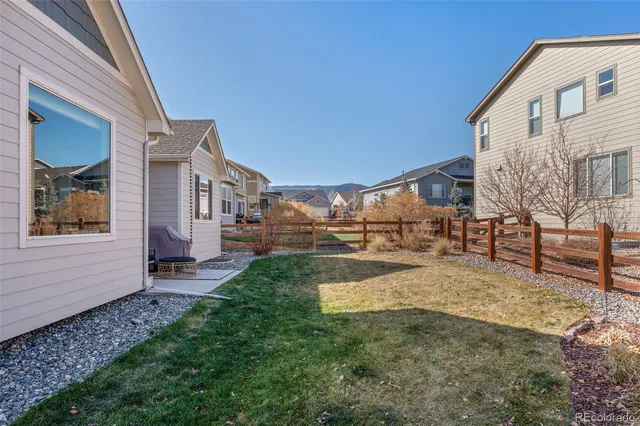 a view of a house with pool and chair