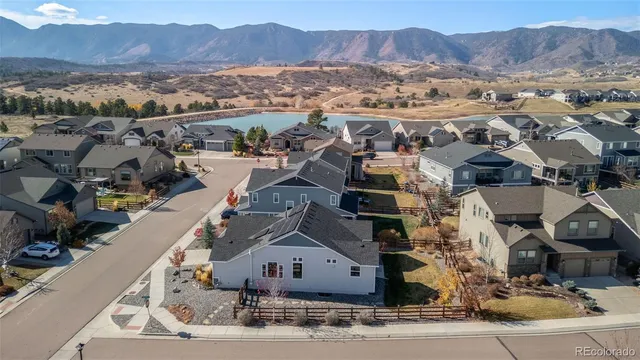 an aerial view of residential houses and outdoor space