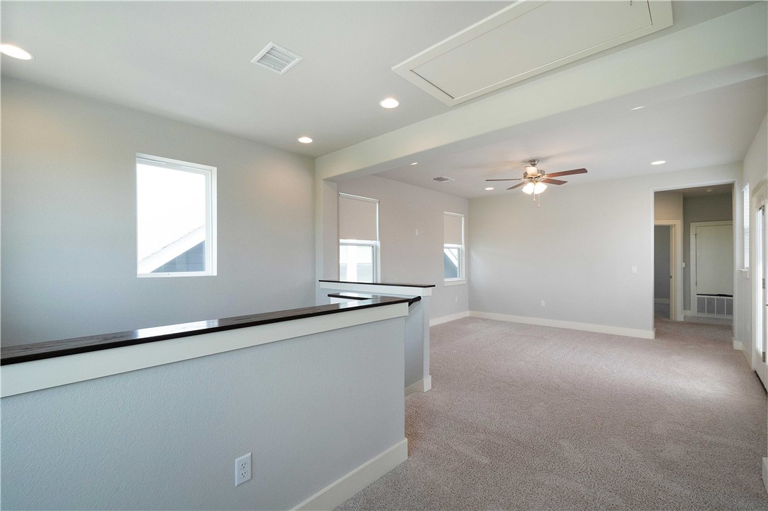 9124 Cattle Baron Path Austin, TX 78747 - Photo 19 of 36 an empty room with windows and entrance