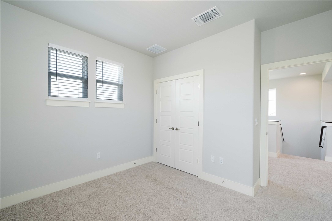 9124 Cattle Baron Path Austin, TX 78747 - Photo 21 of 36 a view of an empty room with a window