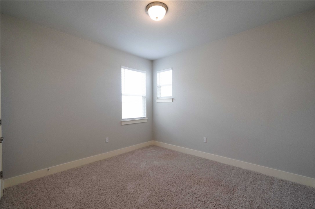 9124 Cattle Baron Path Austin, TX 78747 - Photo 22 of 36 an empty room with windows and window