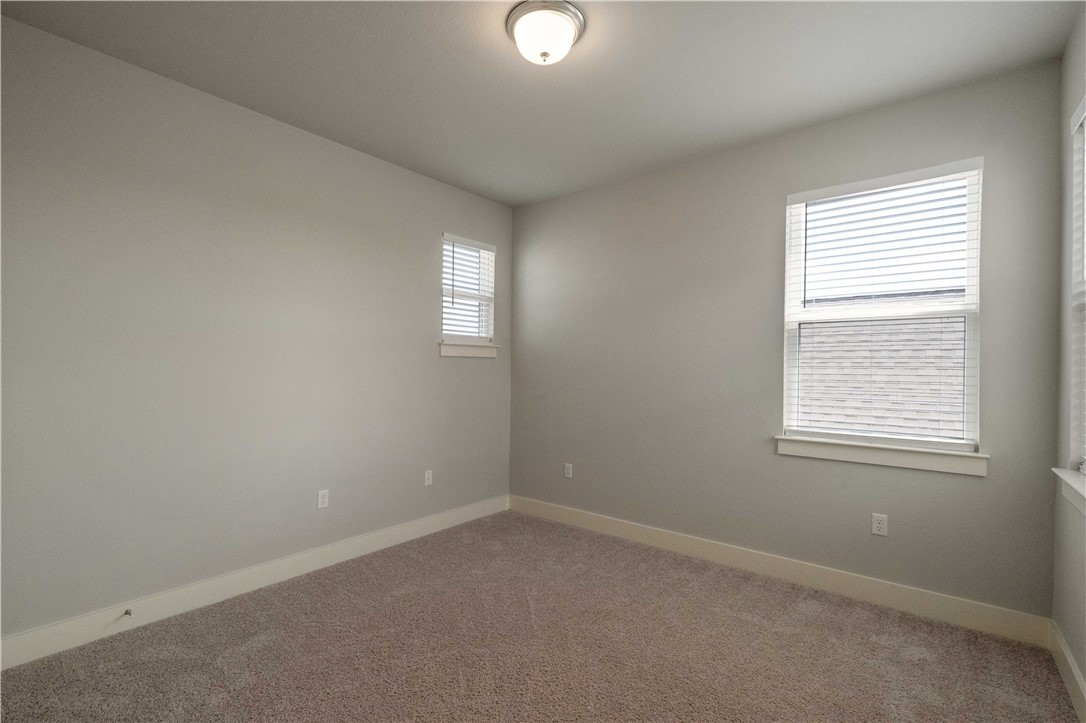 9124 Cattle Baron Path Austin, TX 78747 - Photo 24 of 36 an empty room with a window and a mirror